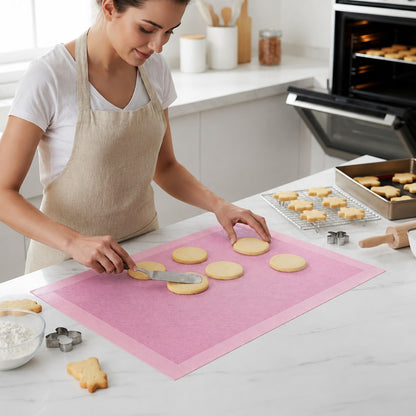 Tapis de cuisson rose avec biscuits ronds