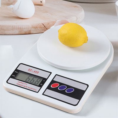Balance Cuisine digitale blanche avec citron