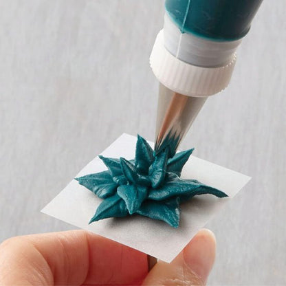 Douille pâtisserie créant une décoration bleue étoilée